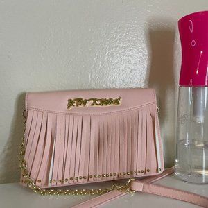 Pink Betsey Johnson wallet on a strap